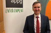 Andrew Pakes MP standing in front of Environment APPG banner